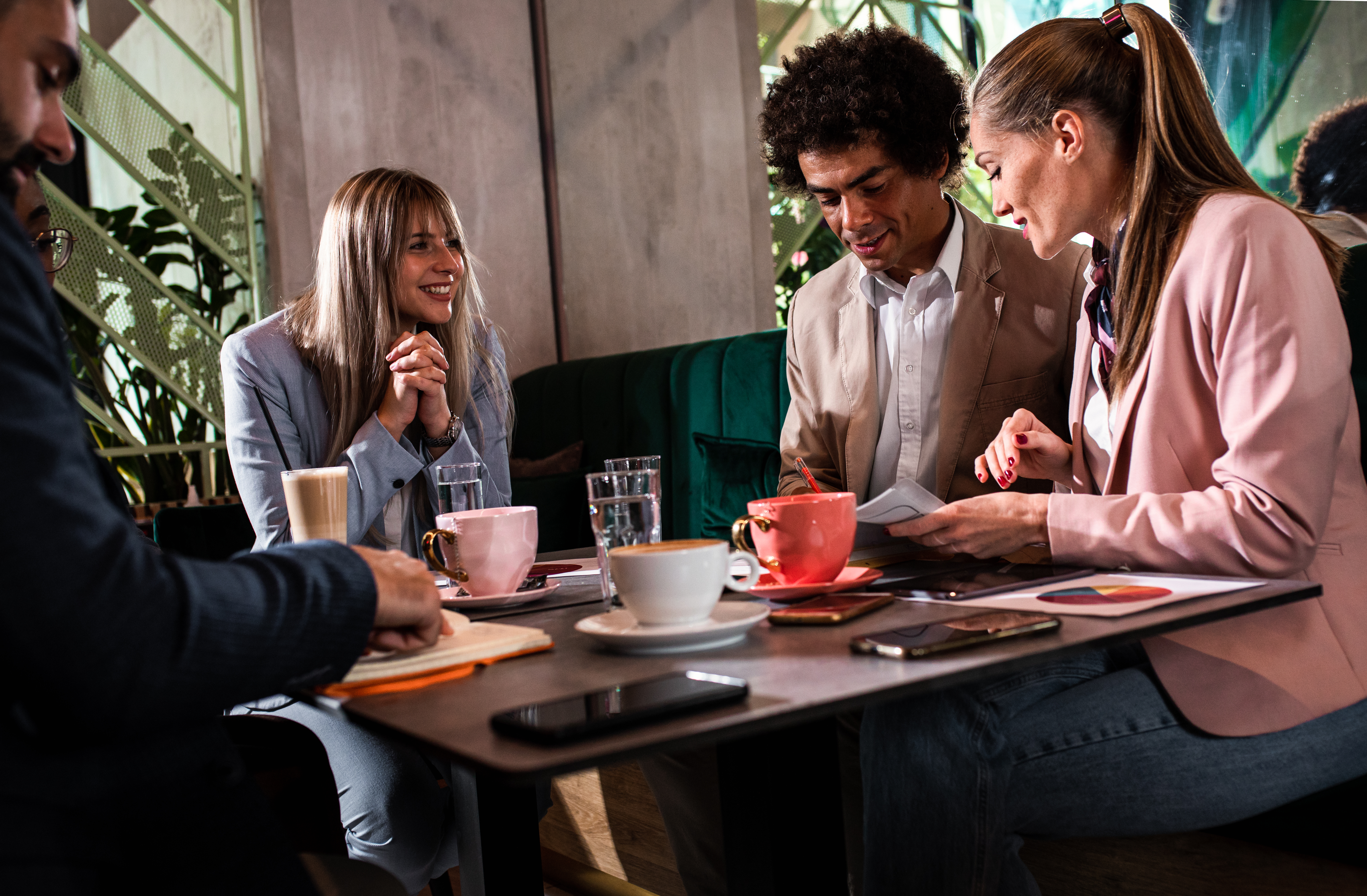 diverse team meeting coffee casual office