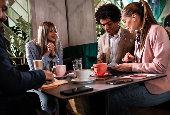diverse team meeting coffee casual office