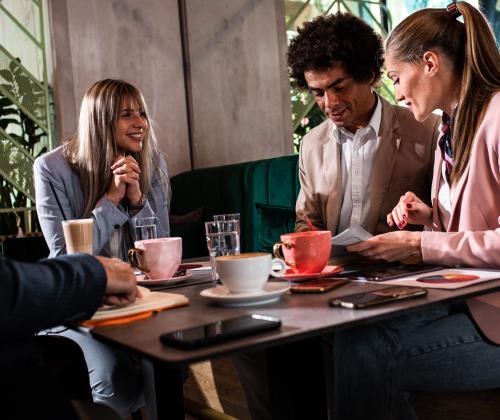 diverse team meeting coffee casual office